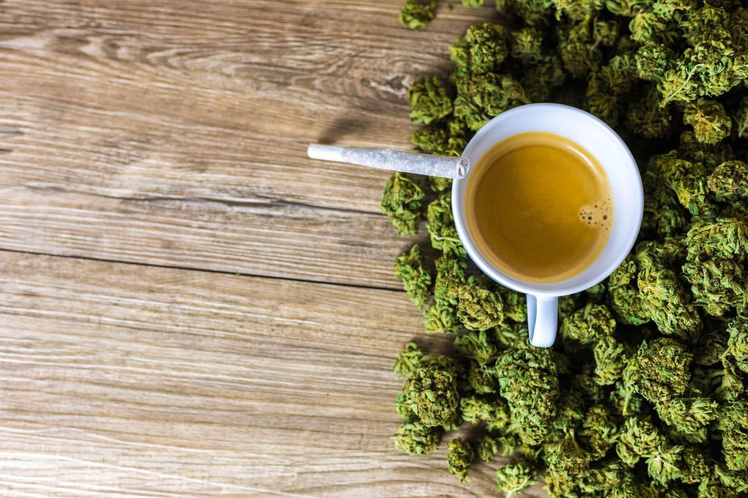 Cup of coffee and cannabis buds with joint on wooden table, Delta-8 THC concept